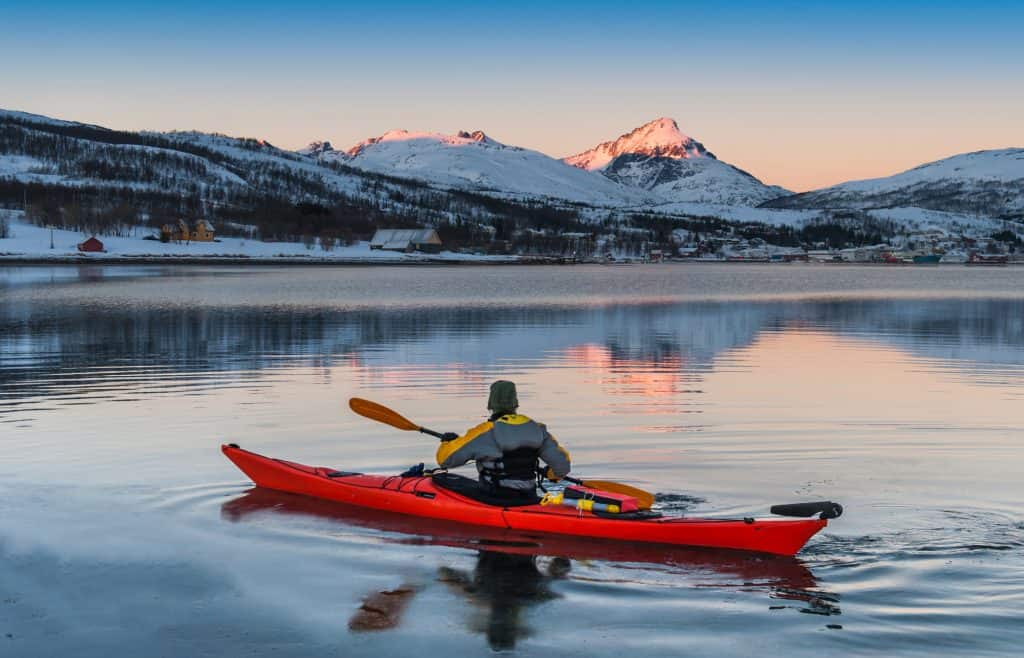 Kayaking in winter landscape