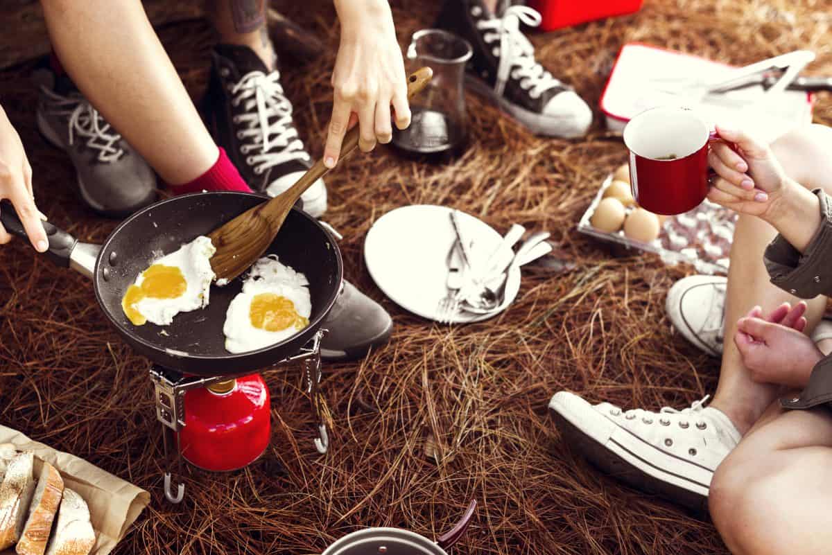 cooking outdoors on a camp stove