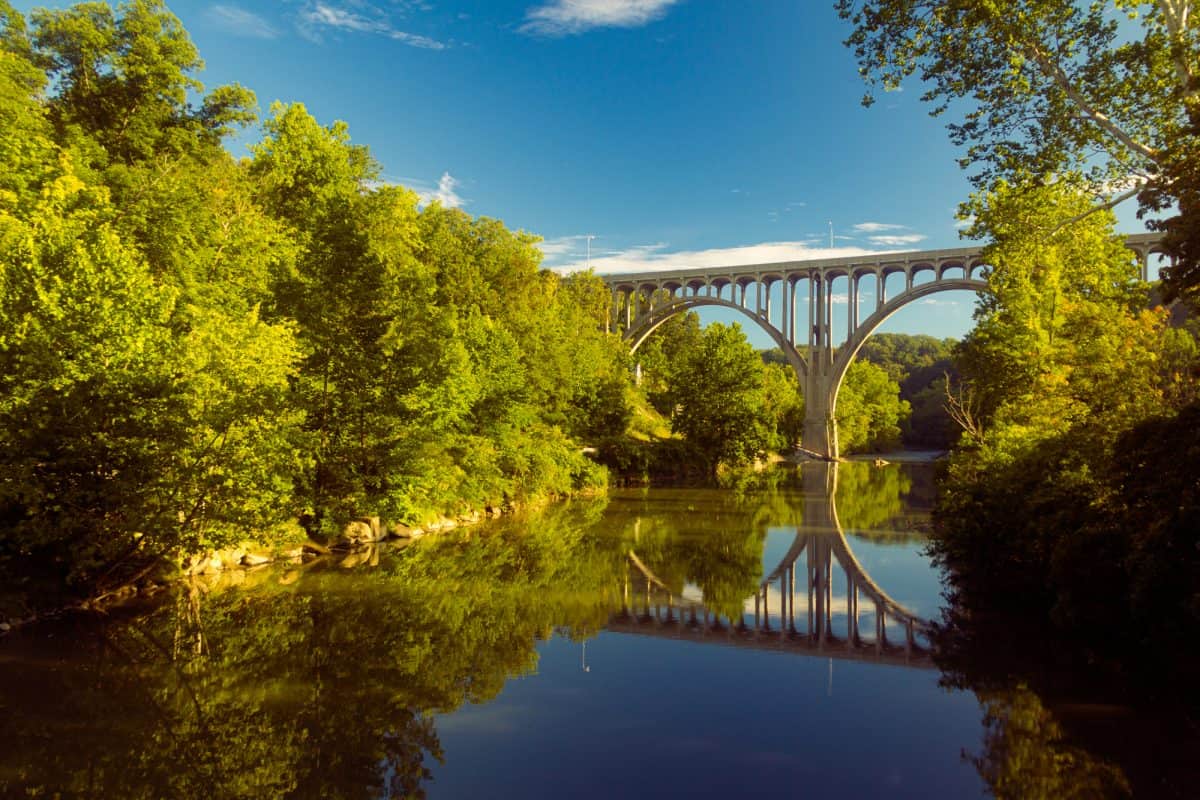 Arch bridge spanning a Cuyahoga river in Cuyahoga Valley National Park